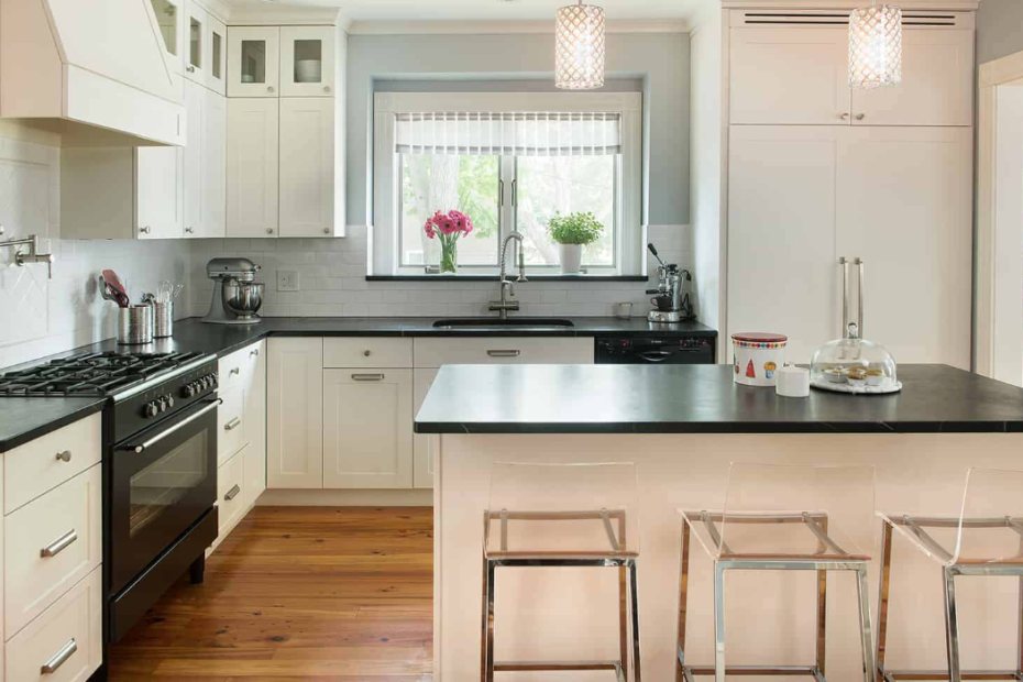 Elegance Kitchen Cream Cabinets and Black Granite Countertops